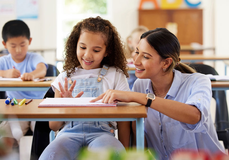 Teacher aide in classroom.
